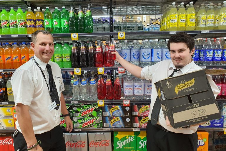 Two gentlemen stack shelves at Murray Bridge Drakes Supermarket
