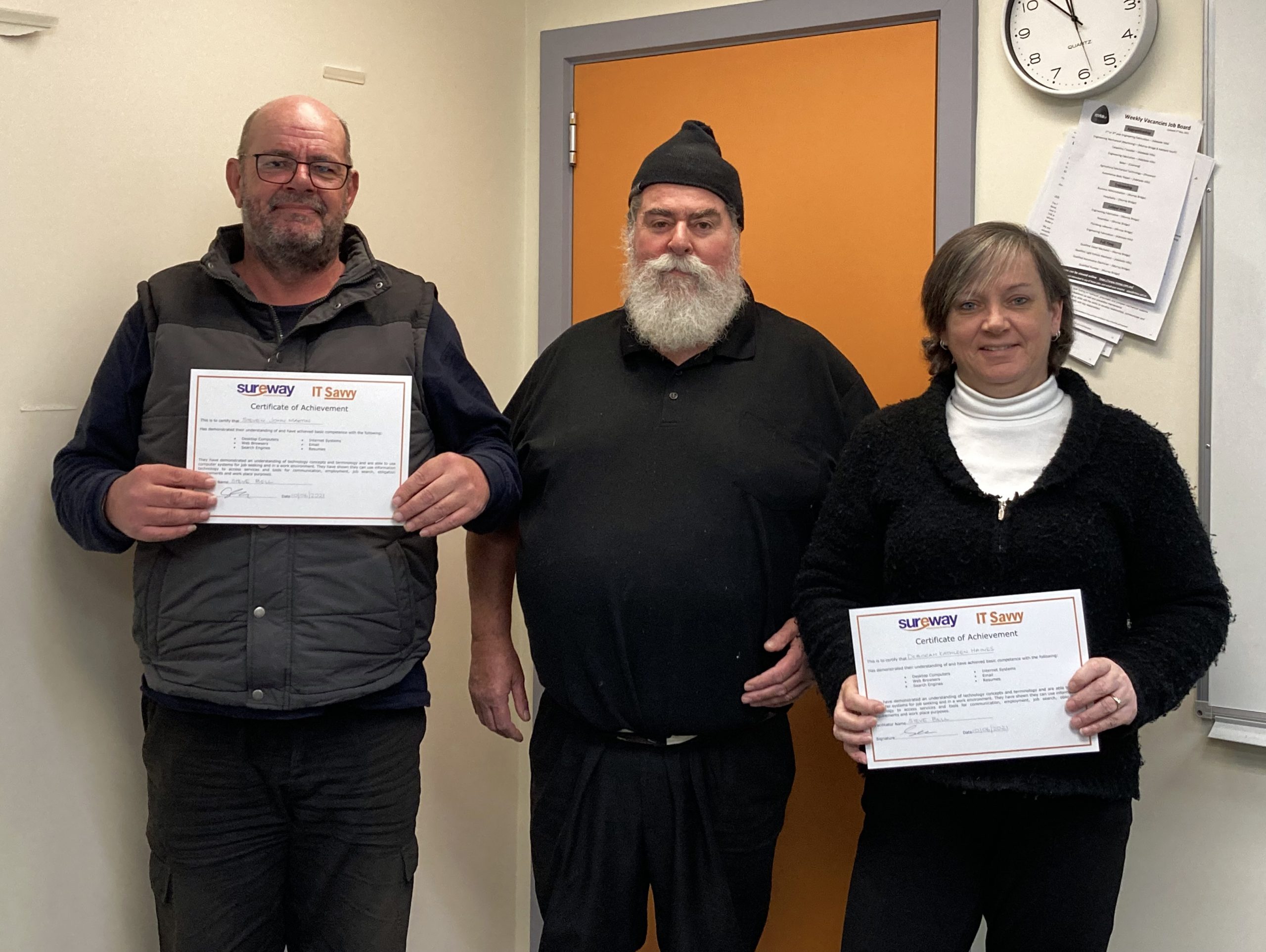 Three people smiling with certificates after completing the course